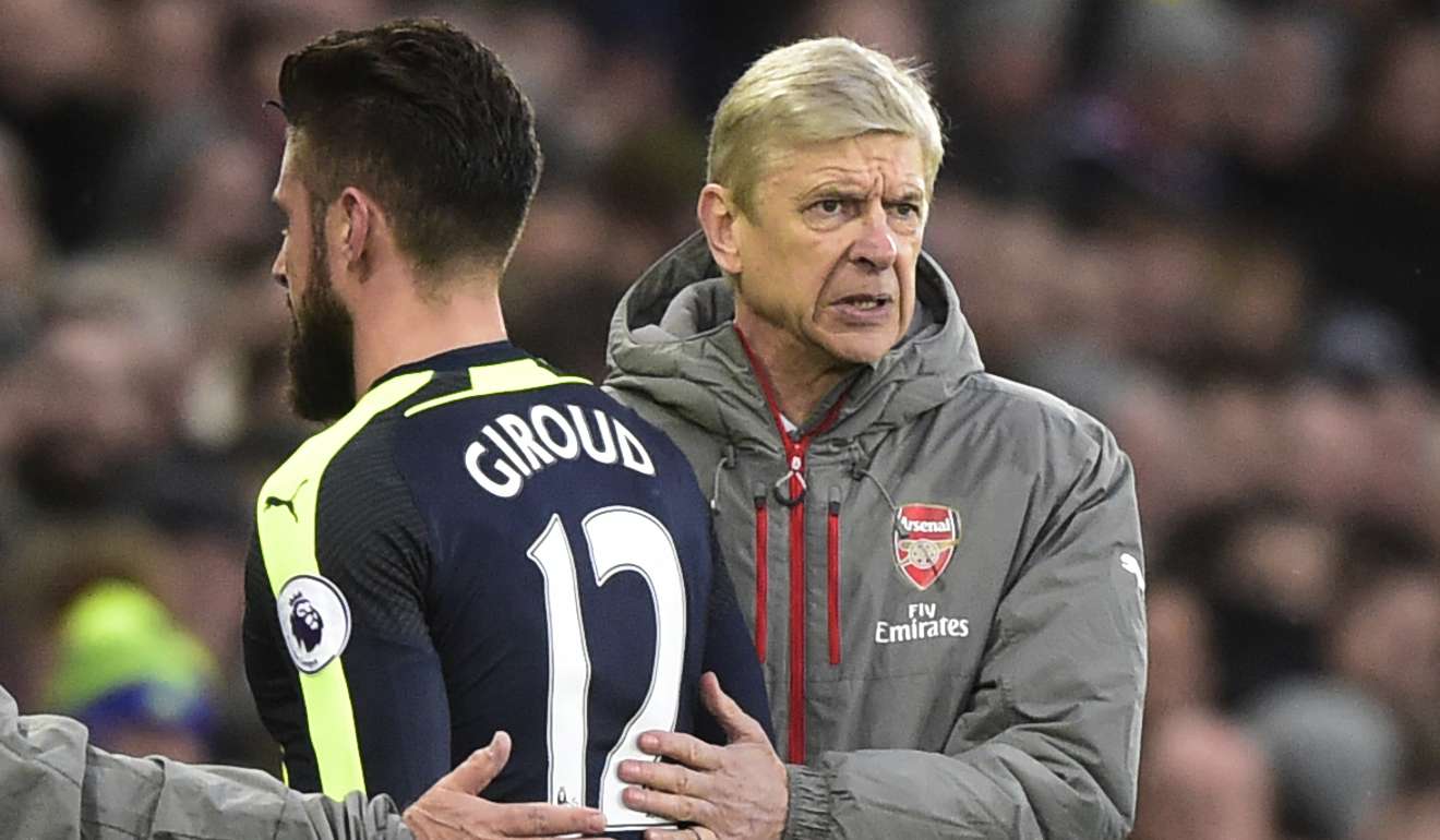 Arsenal's Olivier Giroud walks past manager Arsene Wenger as he is substituted. Photo: Reuters