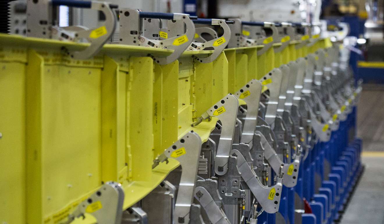 A wing spar is seen in a spar assembly line machine during production of a Boeing Co. 737 MAX jetliner at the company's manufacturing facility in Renton, Washington. Photo: Bloomberg