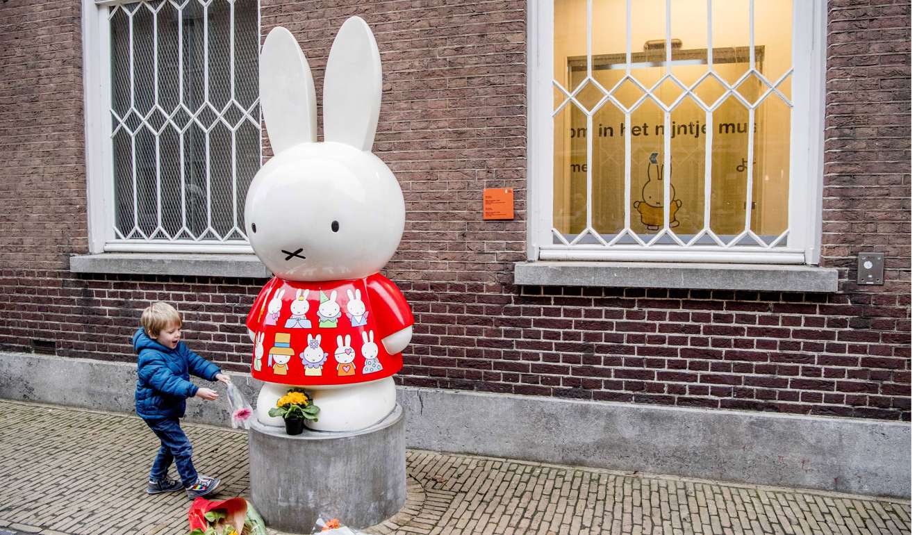 Flowers are placed at a statue outside the Nijntje Museum in Utrecht, Netherlands. Photo: EPA