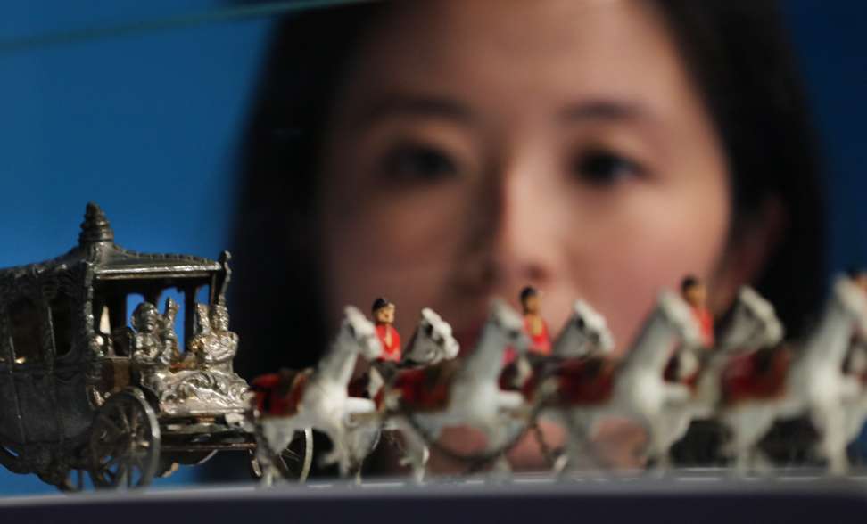 A miniature replica of the Queen Elizabeth II Coronation Coach (1953) displayed at the exhibition. Photo: Felix Wong