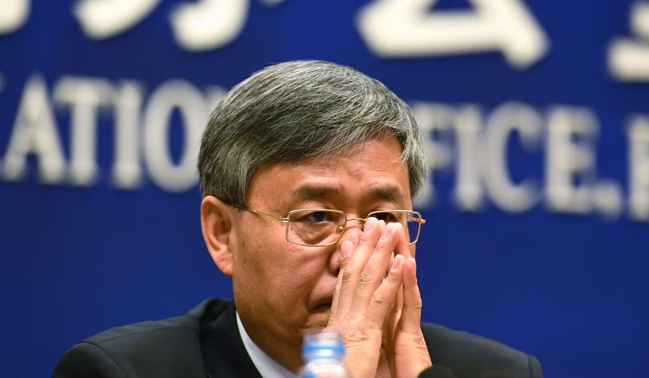 Guo Shuqing, Chairman of the China Banking Regulatory Commission, listens to a question during a press conference in Beijing on March 2, 2017. Photo: AFP