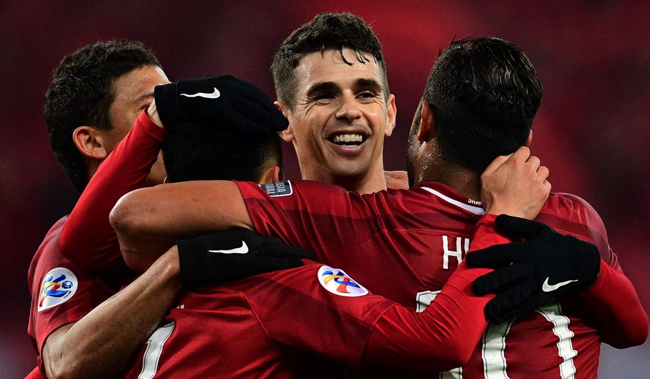 Shanghai SIPG’s Brazilian midfielder Oscar celebrates with his teammates in the AFC Champions League. Photo: AFP
