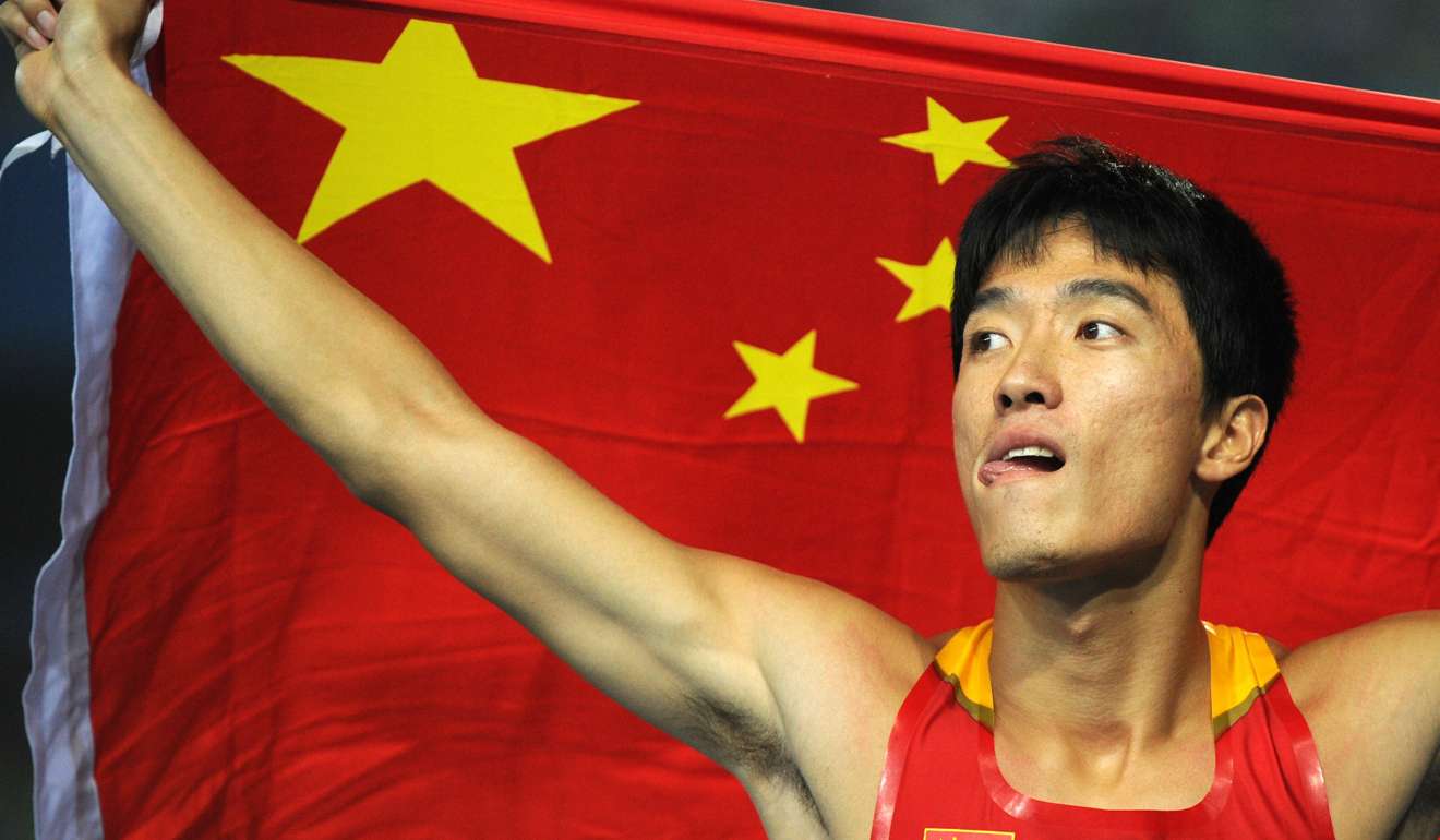 In this 2011 file picture, Liu Xiang displays his national pride after competing at the International Association of Athletics Federations World Championships in Daegu, South Korea. Photo: AFP