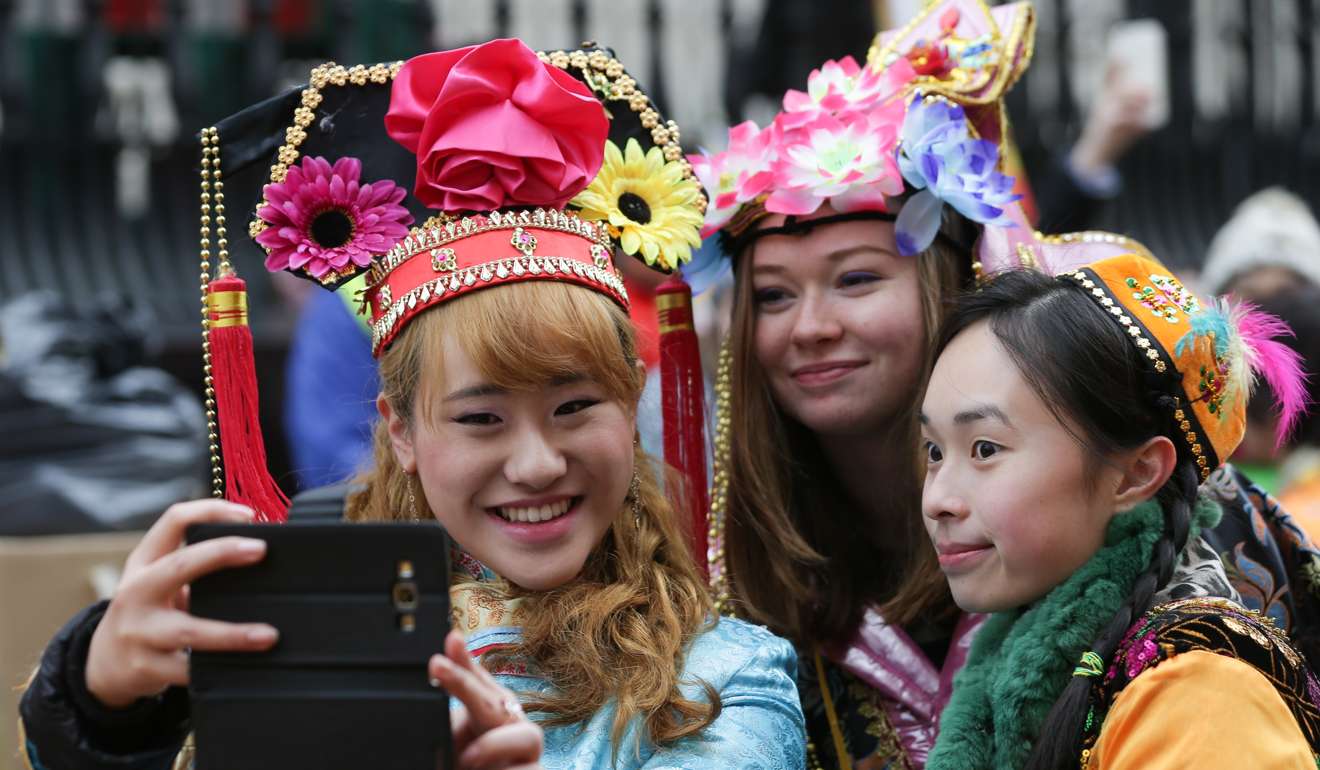 Performers pose for photographs as part of celebrations for the Lunar New Year in central London. Redefining Britain’s relationship with China remains an exercise with the phrase “fill in later” scribbled at the bottom. Photo: AFP