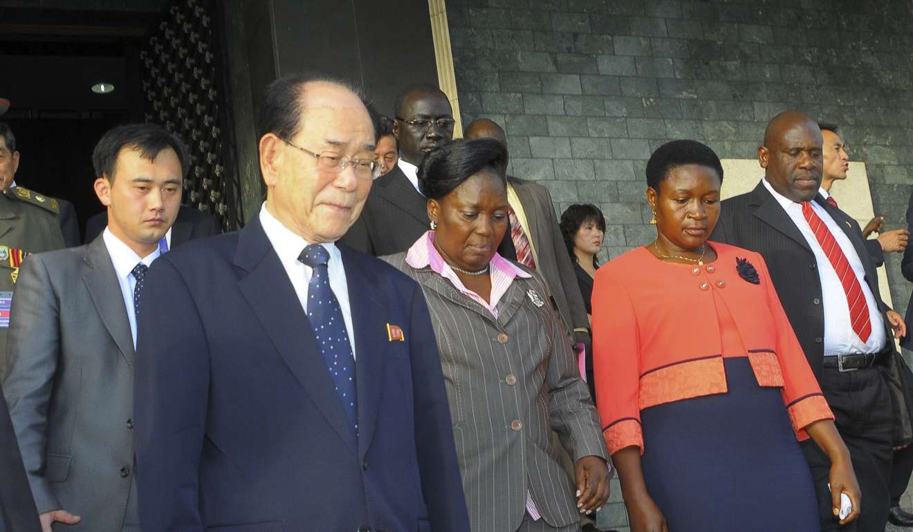 North Korea's ceremonial leader Kim Yong-nam, the head of North Korea's parliament, is escorted into Uganda's parliament by its Speaker Rebecca Kadaga. Photo: AP