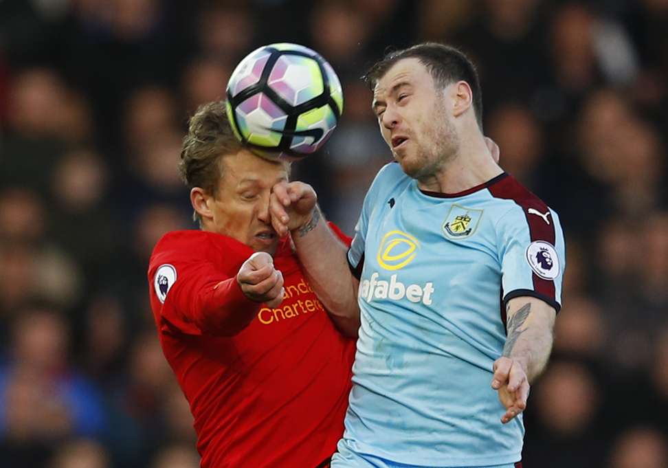 Liverpool’s Lucas Leiva and Burnley’s Ashley Barnes challenge for a header. Photo: Reuters