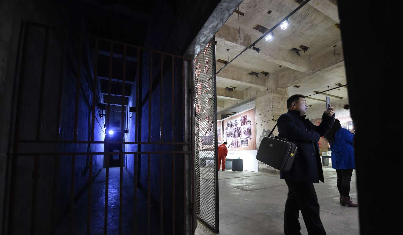 A tourist taking pictures inside the bunker. Photo: AFP