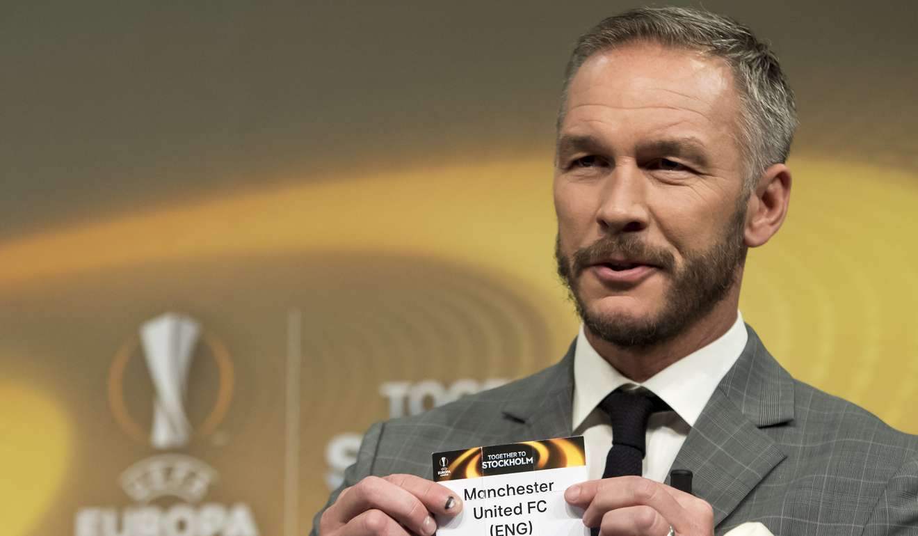Former Swedish soccer player Patrik Andersson draws Manchester United’s name. Photo: EPA
