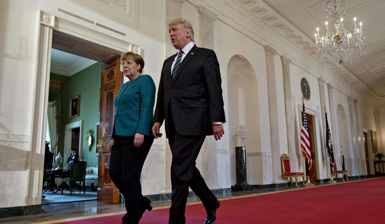 US President Donald Trump (right) and German Chancellor Angela Merkel (left) met for the first time face-to-face where Trump reiterated his support of Nato but insists member nations pay their fair share. Photo: Bloomberg
