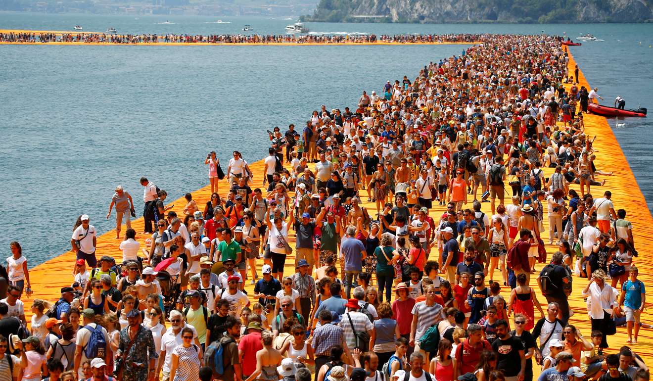 People crowd Christo’s installation The Floating Piers on Lake Iseo in July 2016. Photo: Reuters