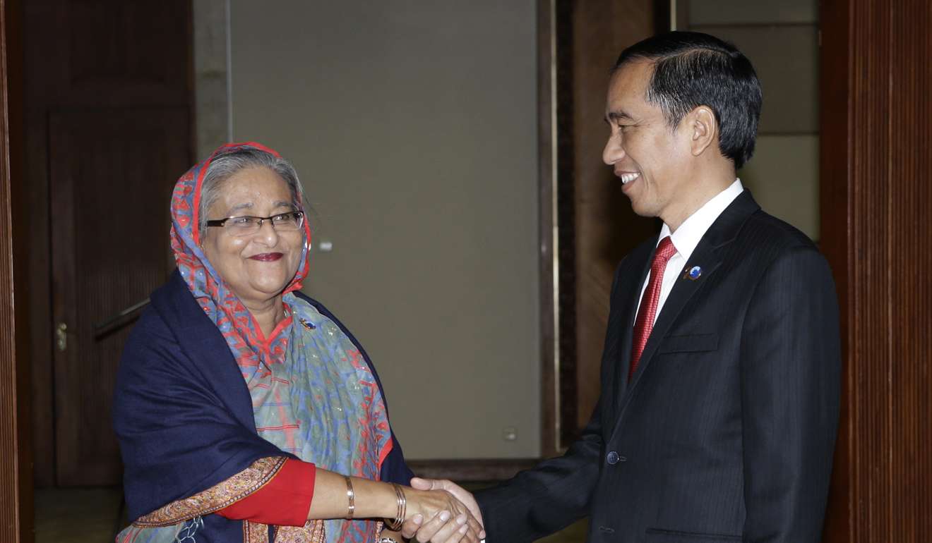 Indonesian President Joko Widodo, right, shakes hands with Bangladeshi Prime Minister Sheikh Hasina at the start of their bilateral meeting on the sidelines of the Indian Ocean Rim Association (IORA) Summit in Jakarta, Indonesia. Hasina is due to visit India next month. Photo: AP