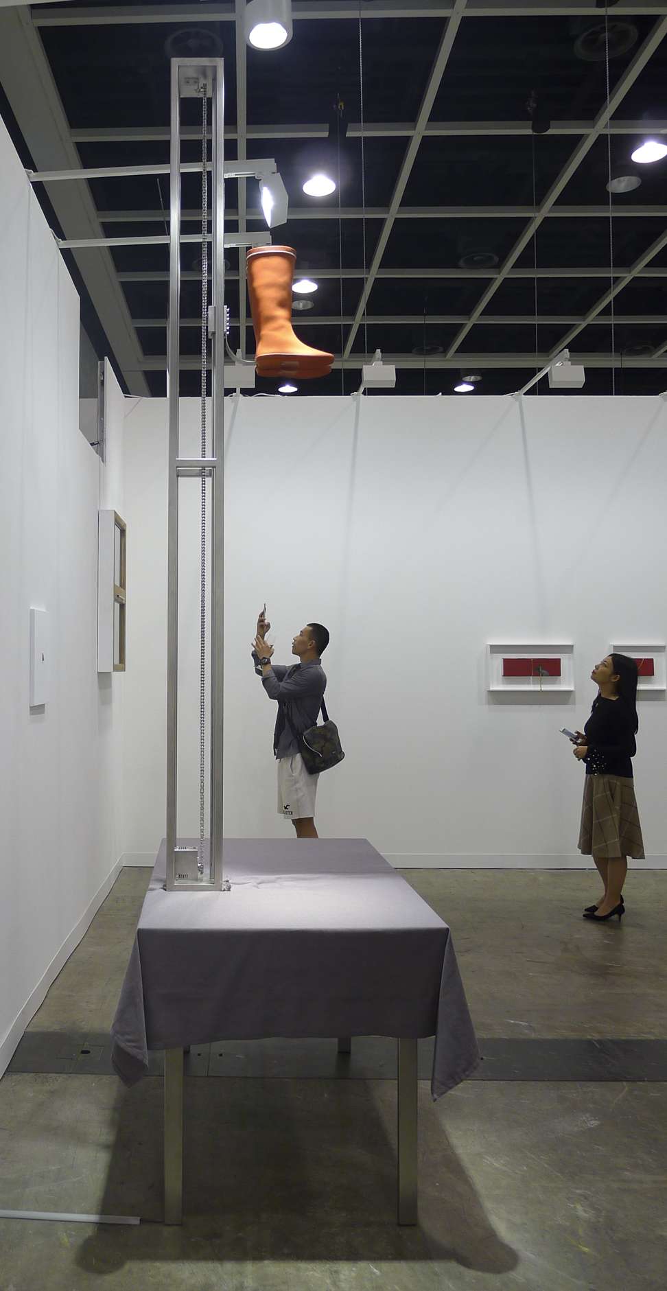 Kinetic installation Pull Me Up Softly by Joyce Ho propels a pair of red boots upward, then lets them free-fall and disappear from view when observed from afar. Photo: John Batten