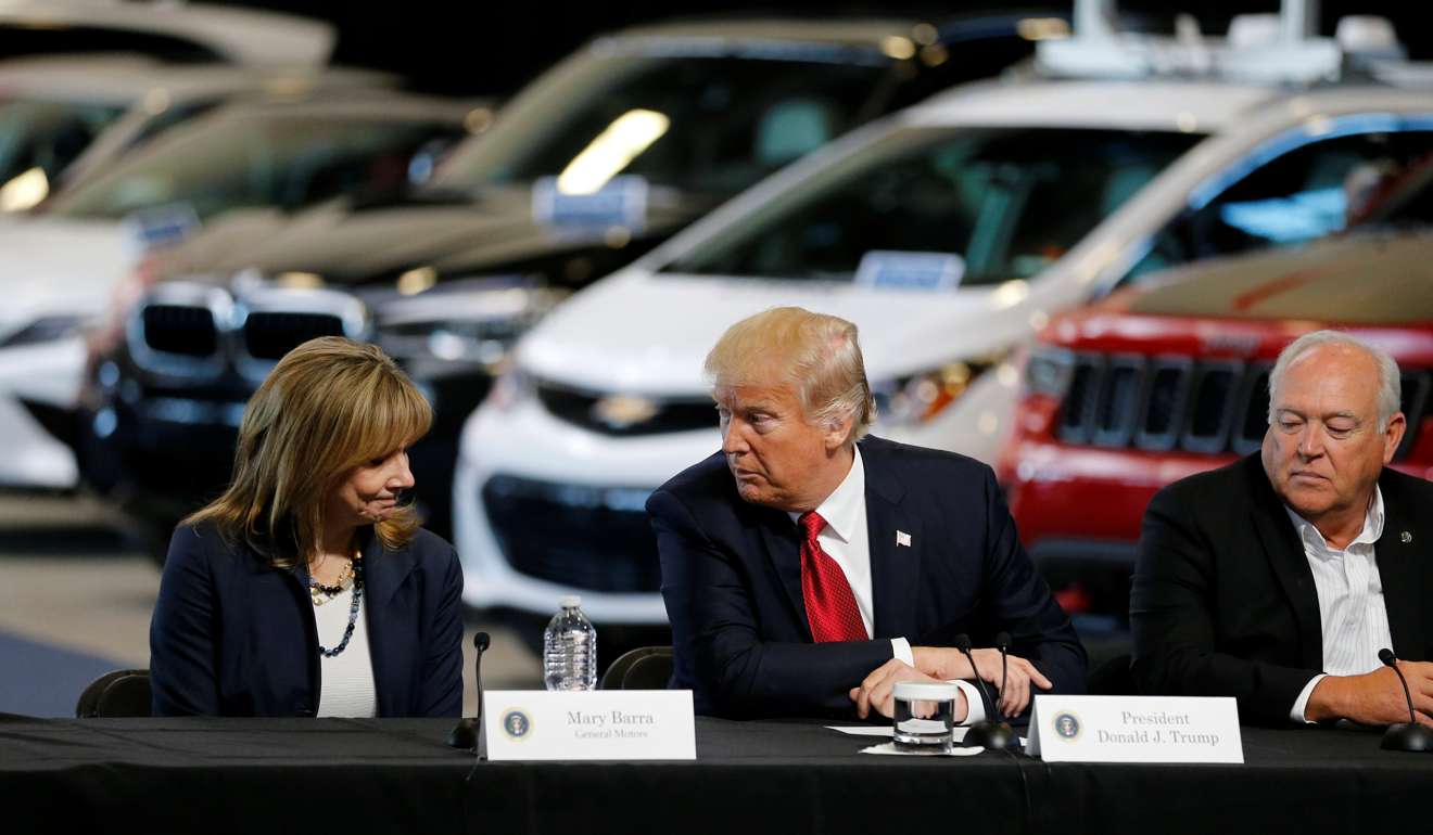 US President Donald Trump talks with General Motors CEO Mary Barra, left, and United Auto Workers President Dennis Williams. Photo: Reuters