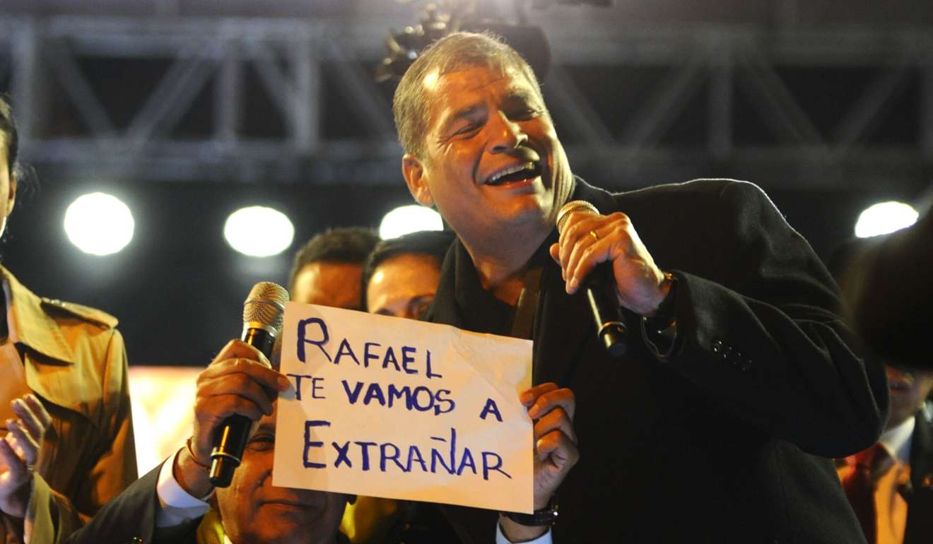 Victorious Ecuadoran presidential candidate Lenin Moreno shows a sign that reads “Rafael we are going to miss you“during a celebrations in Quito on Sunday. Moreno is the designated heir to President Rafael Correa. Photo: AFP