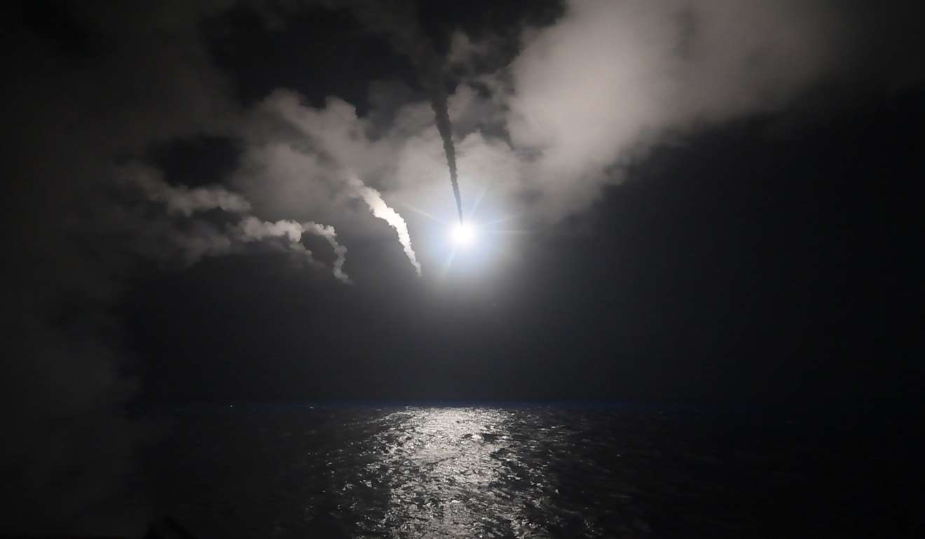 A handout photo made available by the US Navy Office of Information shows a cruise missile streaking towards Syria after being launched from the guided-missile destroyer USS Porter on Friday. Photo: EPA
