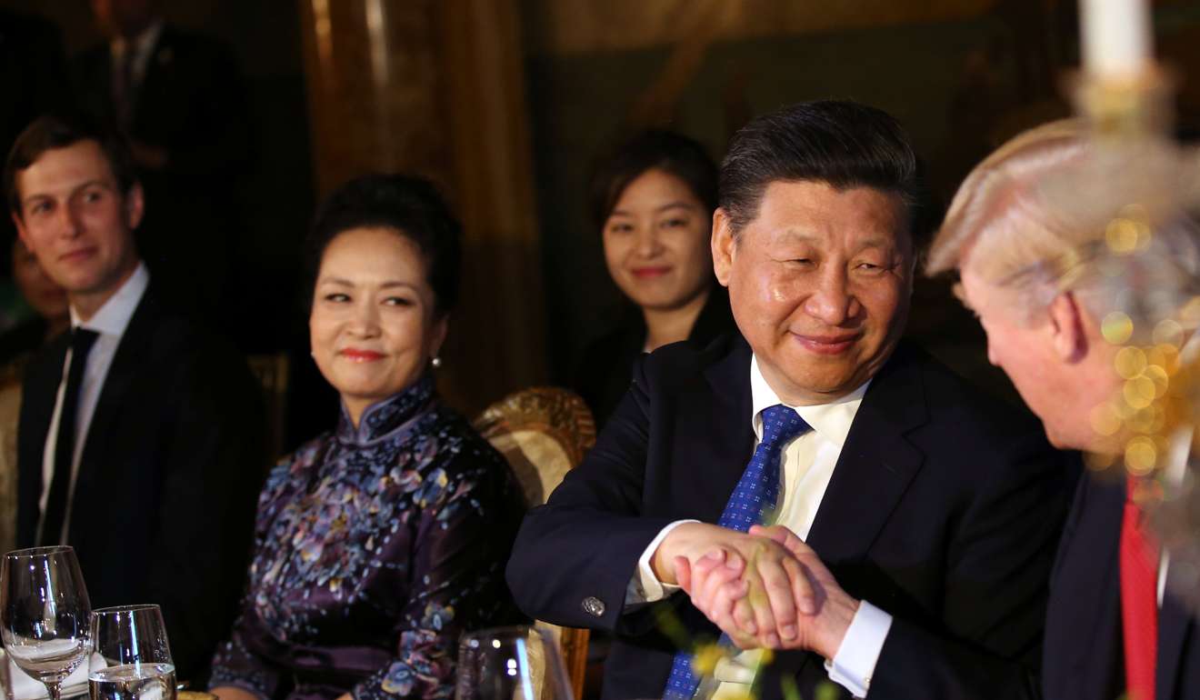 Xi Jinping shakes hands with Donald Trump during dinner at the Mar-a-Lago estate. Photo: Reuters