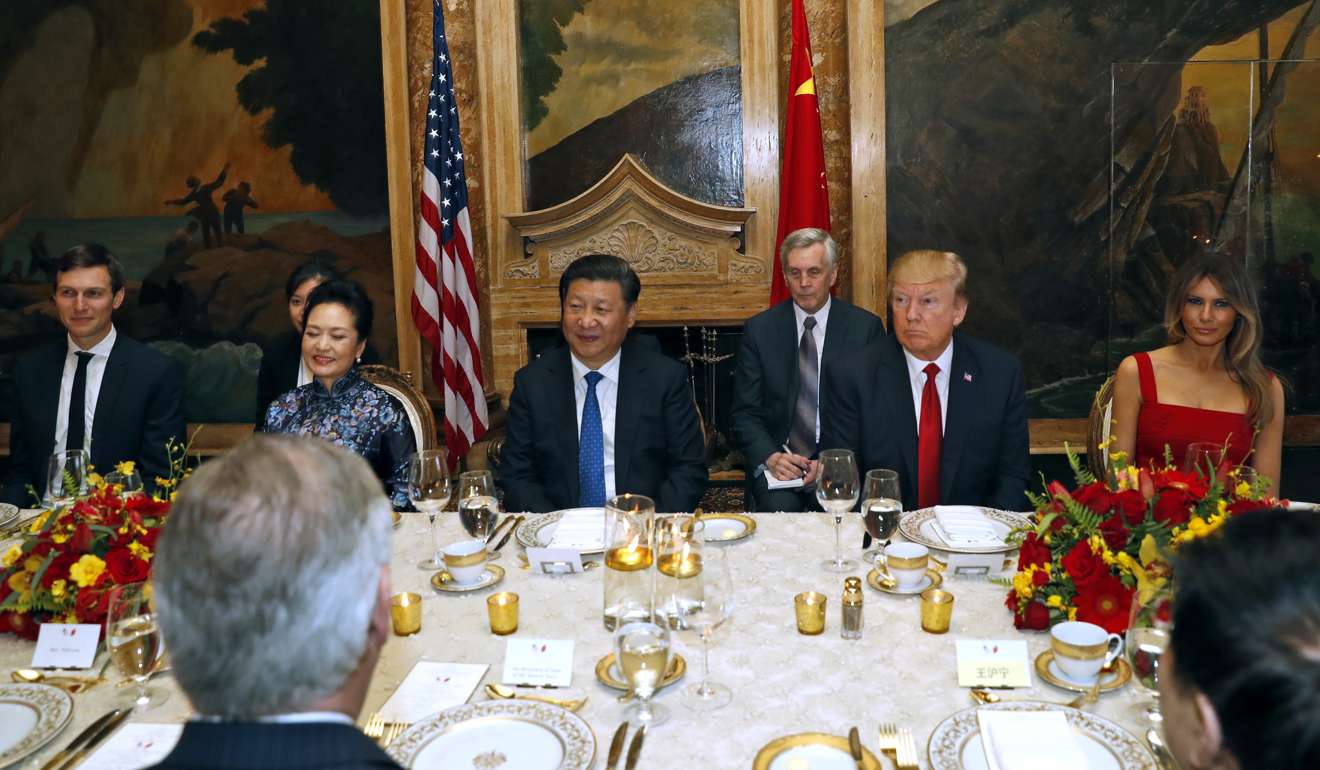 President Donald Trump and Chinese President Xi Jinping are seated during a dinner at Mar-a-Lago. Photo: AP