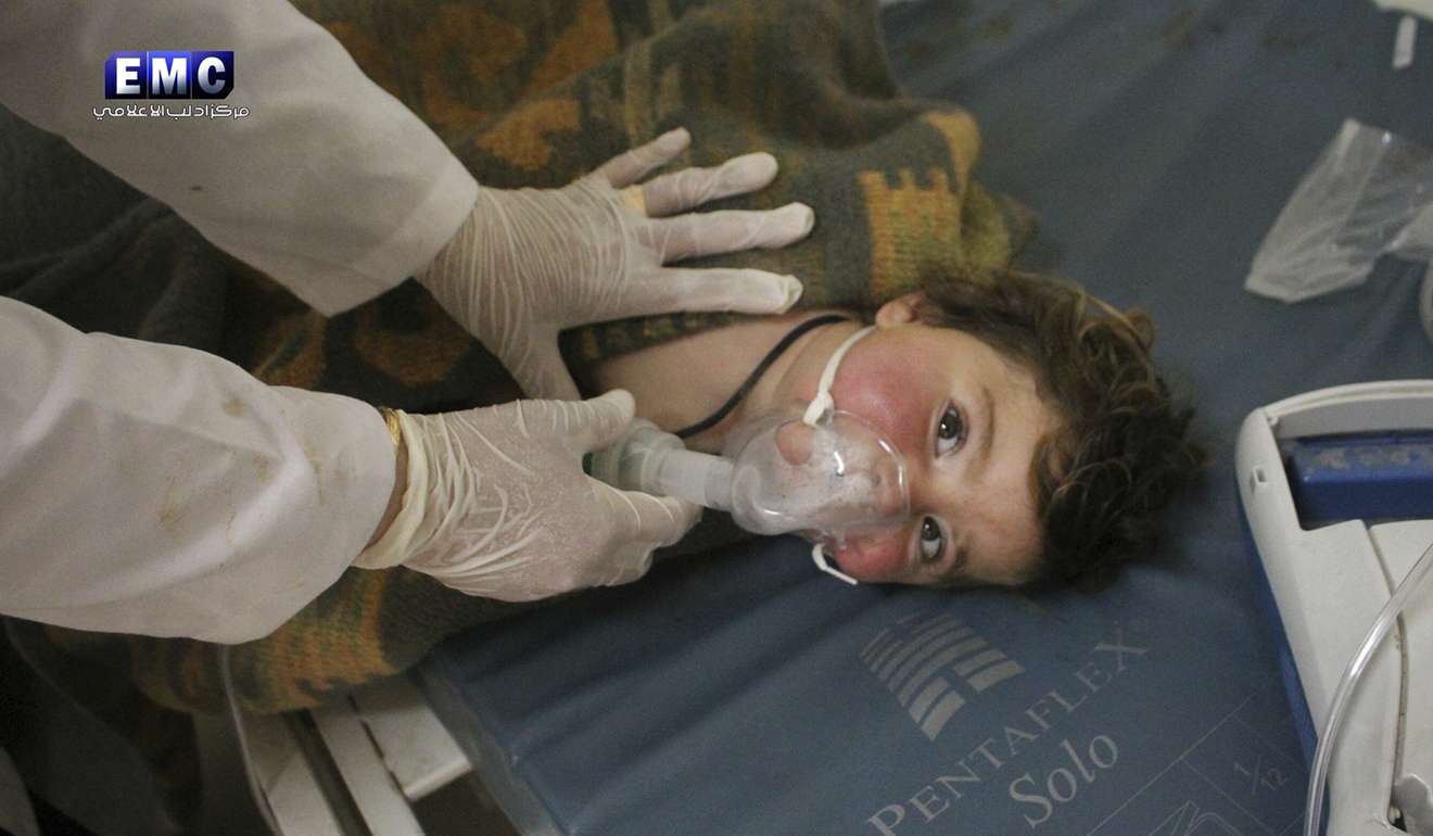 This photo provided on April 4 by the Syrian anti-government activist group Edlib Media Centre, which has been authenticated based on its contents and other AP reporting, shows a Syrian doctor treating a child following a suspected chemical attack, at a makeshift hospital, in the town of Khan Sheikhoun, northern Idlib province, Syria. Photo: Edlib Media Centre via AP