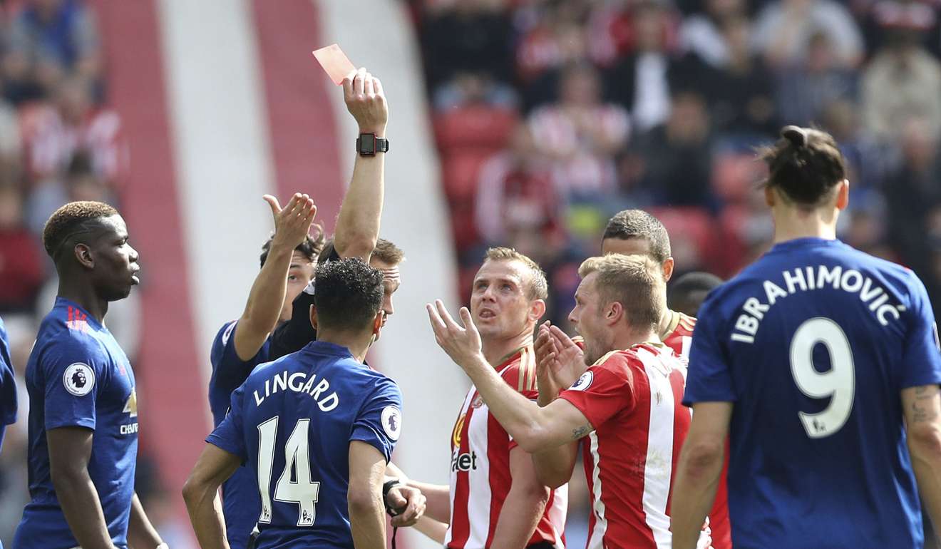 Sunderland's Sebastian Larsson receives a red card. Photo: AP