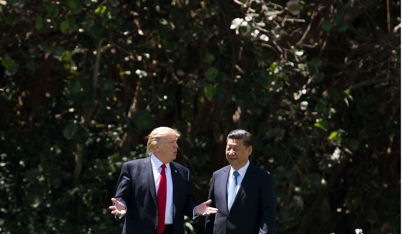 US President Donald Trump and Chinese President Xi Jinping walk together last week at the Mar-a-Lago estate in West Palm Beach, Florida. Trump has made it clear to his guest that he will not shirk from using force against rogue regimes. That includes China’s wayward client North Korea. Photo: AFP