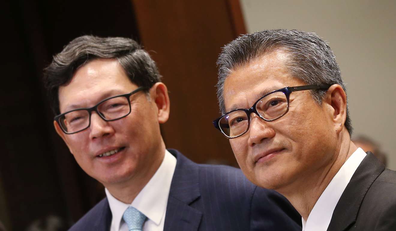 Norman Chan Tak-lam (Left), chief executive of the Hong Kong Monetary Authority, and Paul Chan Mo-po, financial secretary, announced the brand new life annuity scheme has been approved. Photo: David Wong