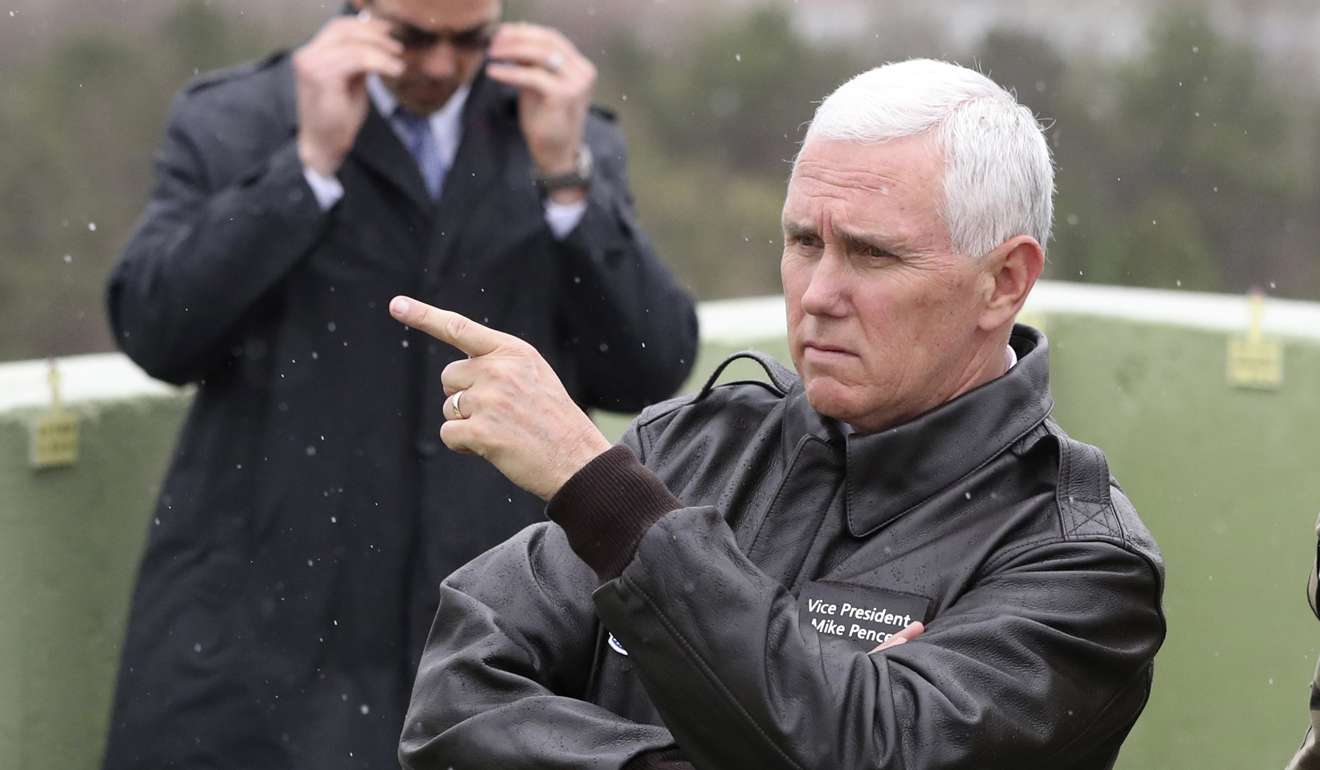 US Vice-President Mike Pence looks at North Korea from Observation Post Ouellette in the Demilitarized Zone (DMZ), near the border village of Panmunjom, which has separated the two Koreas since the Korean War. Photo: AP