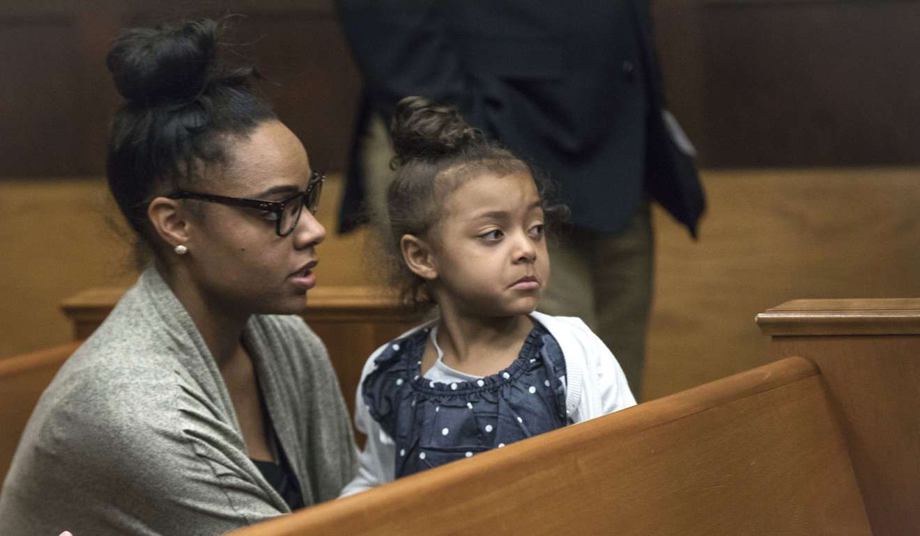 Shayanna Jenkins, who was the fiancée of former New England Patriots tight end Aaron Hernandez, sits in the courtroom with the couple's daughter during jury deliberations in Hernandez's double-murder trial at Suffolk Superior Court in Boston.