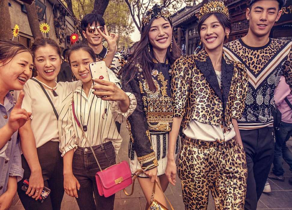 Passers-by taking a selfie with Dolce & Gabbana models in Beijing are captured in this promotional image for the Italian fashion brand’s couture show in the Chinese capital. Photo: Instagram/Dolce & Gabbana