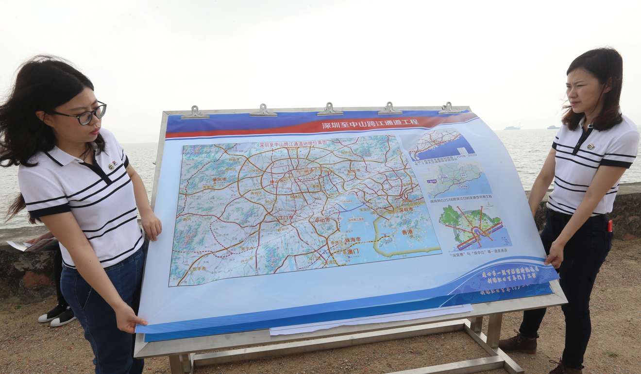Officials show the site map for the landing point of the Shenzhen-Zhongshan Link, across the Pearl River estuary. Photo: Dickson Lee
