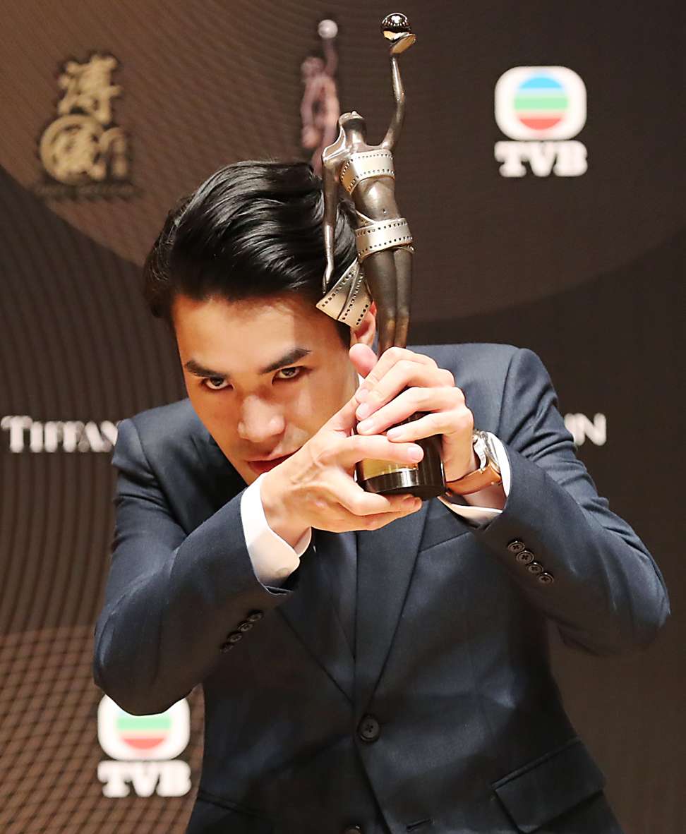 Director of Mad World Wong Chun shows off his award for best new director at the recent Hong Kong Film Awards. Photo: Edward Wong