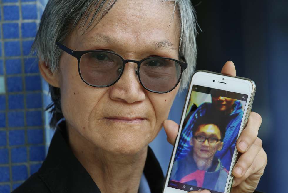 Anika Lai’s mother, Shiu Yuk-chee, displays an image of her son. Photo: K. Y. Cheng