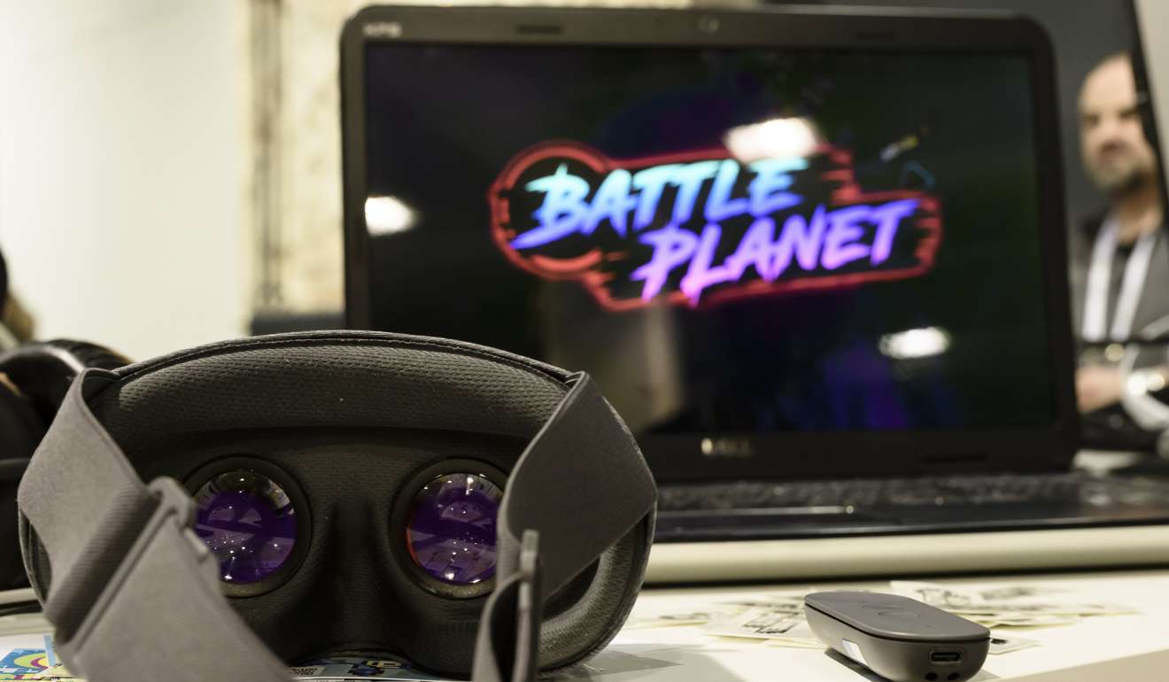 Virtual reality glasses lay in front of a laptop computer showing the name of the game 'Battle Planet' during the 'International Games Week Berlin' in Berlin, Germany. Musicians are experimenting with virtual reality to create different kinds of music. Photo: EPA