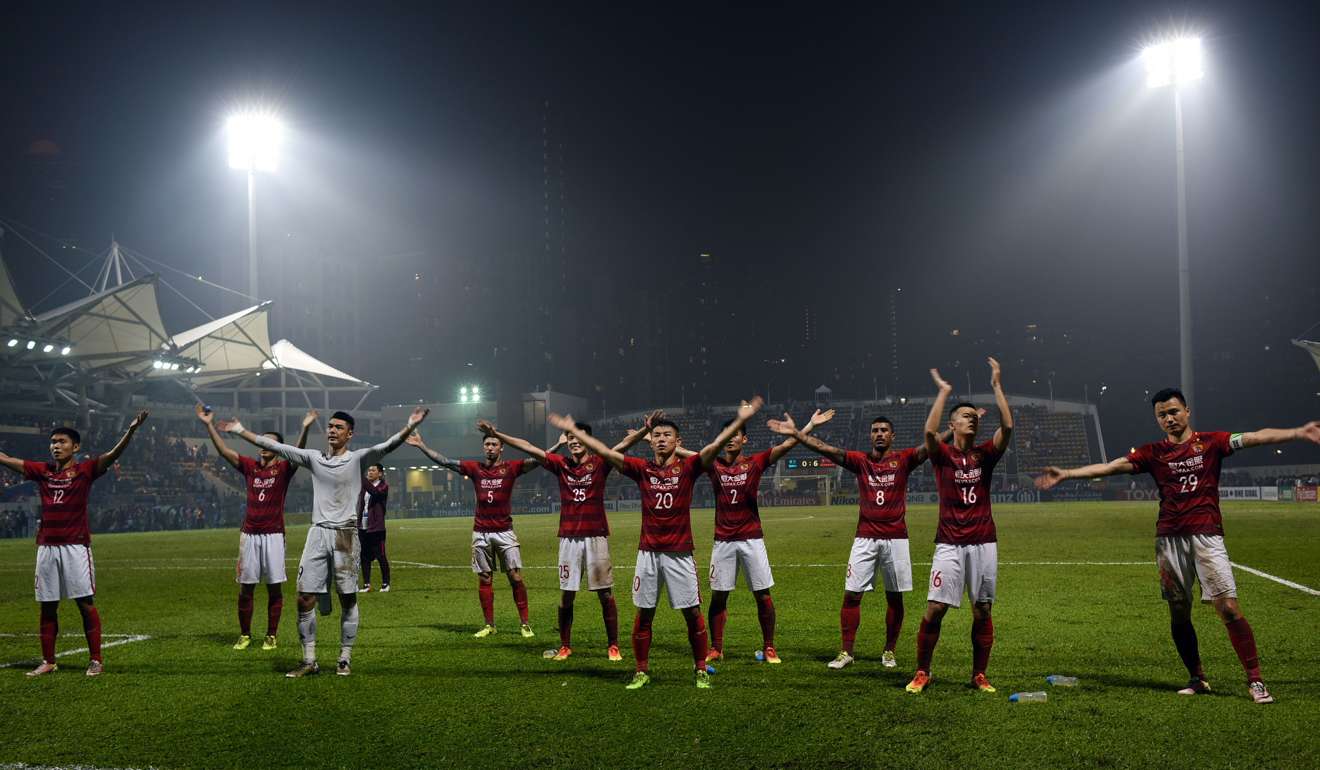 Guangzhou Evergrande players thank their fans after the match at Mong Kok Stadium.