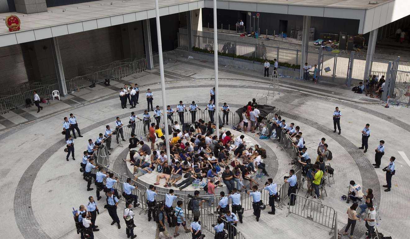 Student protestors are kettled by police at the Civic Square during their week-long protest against Beijing's rules for Hong Kong elections. Police reportedly denied the students access to the bathroom as well as to food or water. Photo: EPA