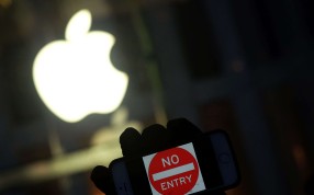 An anti-government protester holding up his iPhone with a sign “No Entry” during a demonstration near the Apple store in New York. The US government on kept its encryption battle with Apple alive, pressing the high-tech giant to help crack an iPhone in a drug case in New York. Photo: AFP An anti-government protester holding up his iPhone with a sign “No Entry” during a demonstration near the Apple store in New York. The US government on kept its encryption battle with Apple alive, pressing the high-tech giant to help crack an iPhone in a drug case in New York. Photo: AFP