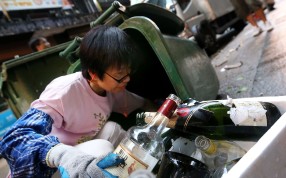 Empty bottles are collected from Hong Kong’s main bar district Lan Kwai Fong in Central. Photo: SCMP Pictures