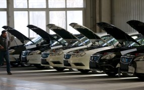 A row of electric cars at a factory operated by Beijing Electric Vehicle, funded by BAIC Group. Japan’s GLM is targeting Chinese carmakers with its EV technology. Photo: Reuters