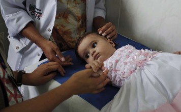 A six-month-old baby is checked for Zika virus in Juazeirinho, Brazil. Photo: Los Angeles Times