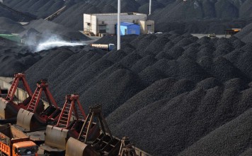 Coal ready for loading at Lianyungang port in Jiangsu province. Inventories have been reduced across the country, resulting in a 4 per cent spike in domestic prices in June. But analysts predict the rise is only temporary. Photo: Reuters