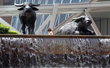 Outside the Hong Kong Stock Exchange in Central. The new closing auction session is expected to boost turnover and keep the city in line with international markets. Photo: Dickson Lee