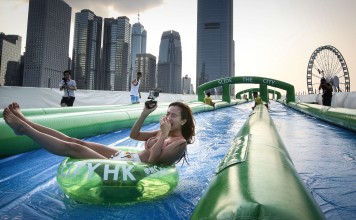 A woman tries out the Slide the City facilities at the Central Harbourfront. Photo: Edward Wong