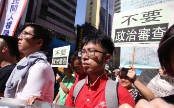 Disqualified candidate Yeung Ke-cheong (Centre) marches to Central Government Offices in Admiralty from Causeway Bay as part of the protest against disqualification of Legco candidates. Photo: Dickson Lee