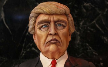 A cake made in the image of Donald Trump on display at his election night rally in Manhattan, New York. Will Trump build the equivalent of the Great Wall of China along the Mexican border? Will he ban Muslims from entering the US? Will he tear up international trade agreements? Photo: Reuters