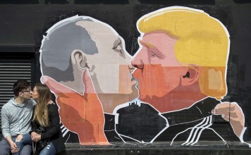 Graffiti depicting Russian President Vladimir Putin and US President-elect Donald Trump, on the walls of a bar in Lithuania. Photo: AP