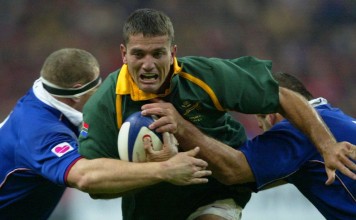 South African scrum-half Joost Van Der Westhuizen is tackled by French props Pieter De Villiers and Jean-Jacques Crenca during a rugby test match in 2001 at the Stade de France, Paris. Photo: AFP
