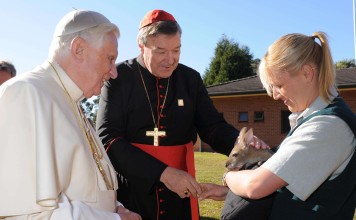 Former head of the Catholic Church in Australia Cardinal George Pell patting a wallaby with former pope Benedict XVI in Sydney in July, 2008. Photo: Reuters