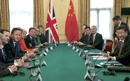 China's President Xi Jinping, right, meets Britain's Prime Minister David Cameron, 3rd left, and other senior members of his government in the cabinet room in 10 Downing Street. Photo: AP China's President Xi Jinping, right, meets Britain's Prime Minister David Cameron, 3rd left, and other senior members of his government in the cabinet room in 10 Downing Street. Photo: AP