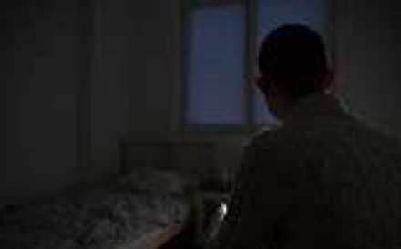 Khaled, originally from Syria and now seeking asylum in Germany, in his room near Berlin. Photo: Raquel Carvalho