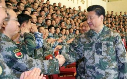 Xi Jinping wears a camouflage uniform at the PLA’s new joint operation command. File Photo