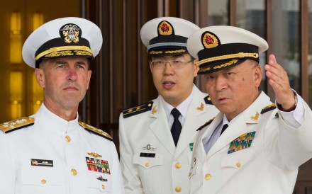 Commander of the Chinese Navy Admiral Wu Shengli points out the layout of the Chinese Navy Headquarters to visiting US Chief of Naval Operations Admiral John Richardson in Beijing on Monday. Photo: Reuters